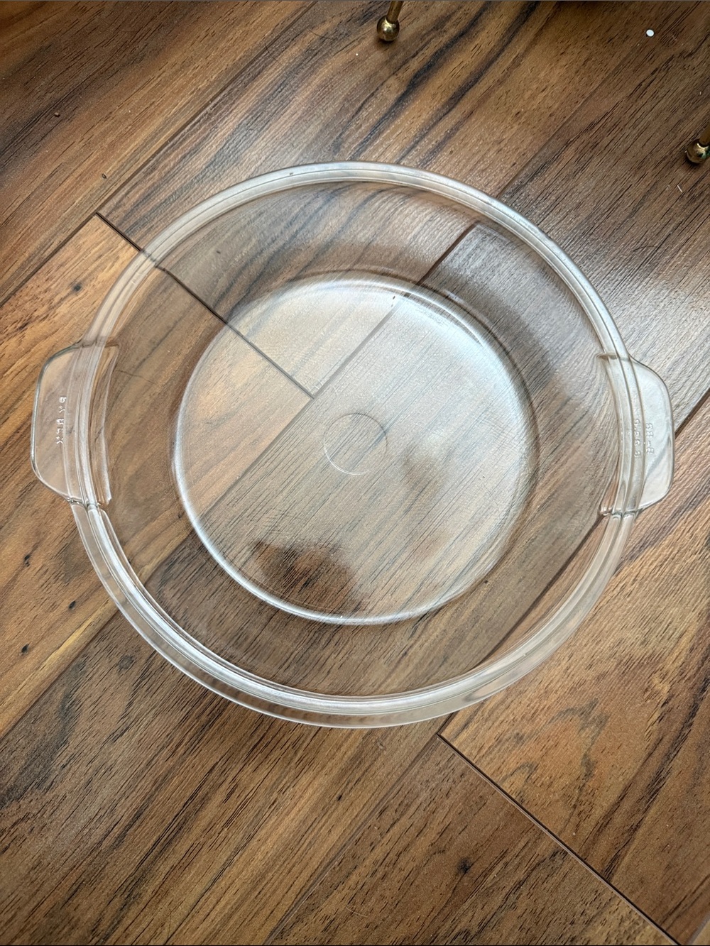The Pyrex 683-C is a clear glass lid designed for vintage Pyrex 1.5-quart